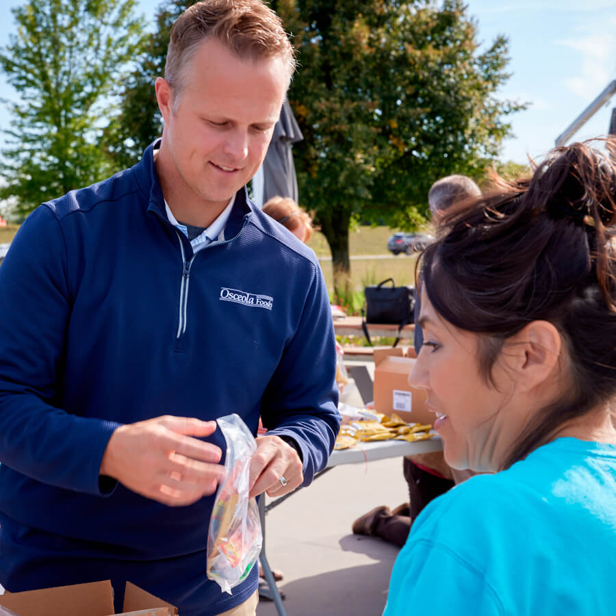 two team members at donation event